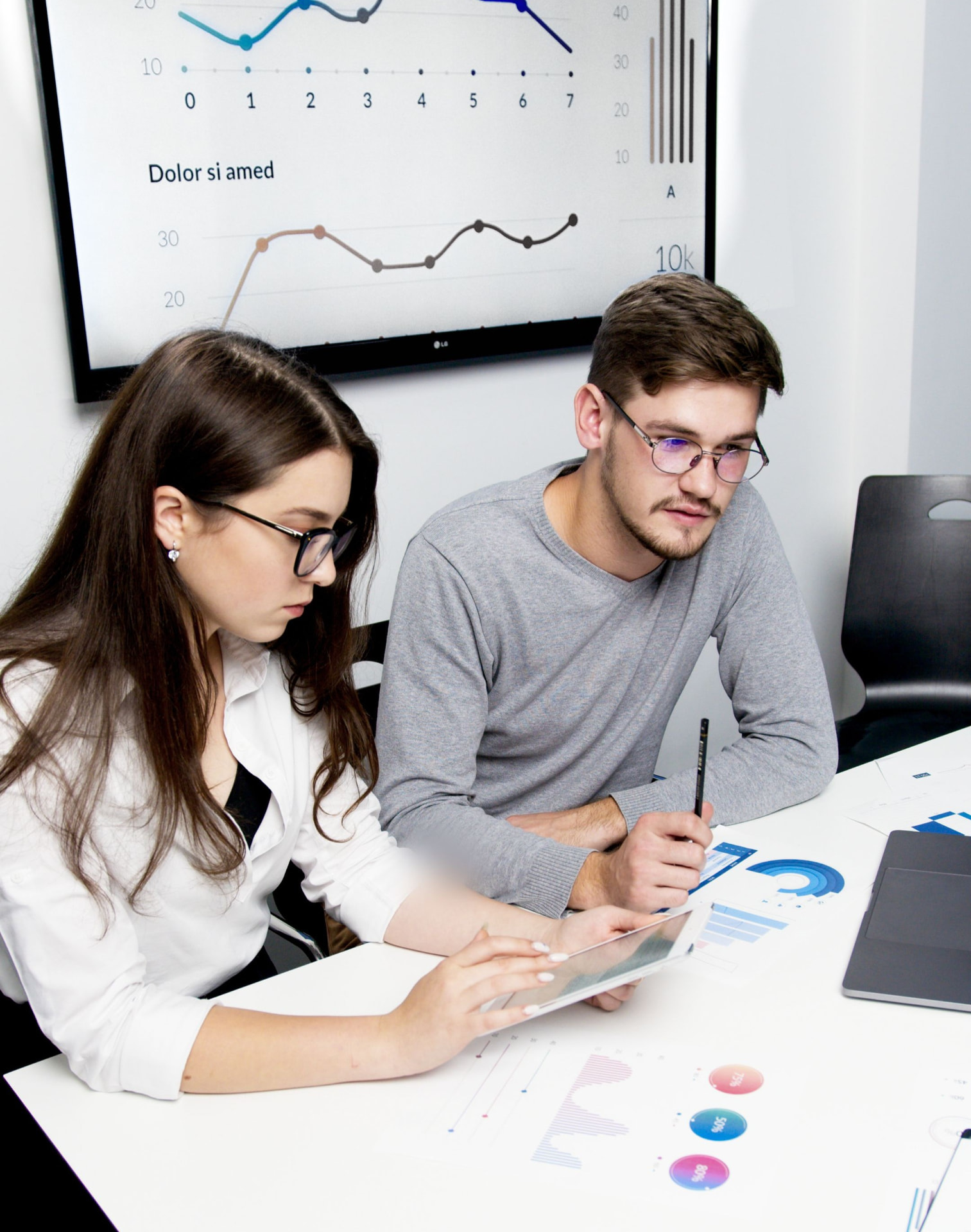 Two professionals reviewing documents together at a desk